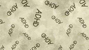 כיתוב ADHD על רקע מסך אפור